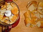 Break the bread up into chunks (or scoop out the soft inside and just use that). In batches, pulse them in a food processor until they're a size you like.