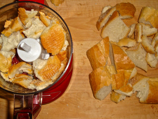 Break the bread up into chunks (or scoop out the soft inside and just use that). In batches, pulse them in a food processor until they're a size you like.