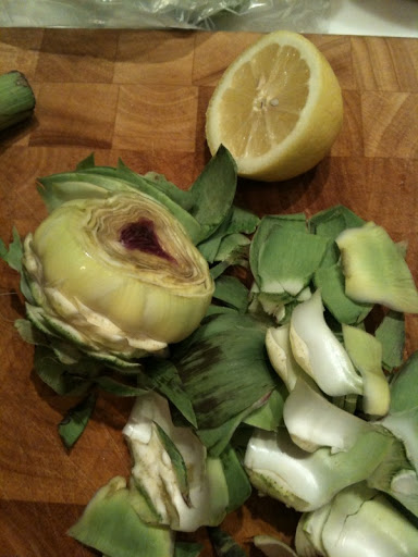 The outer dark green leaves have been snapped off to reveal the tender, light green inner leaves.