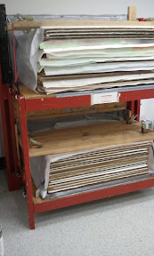 Stacks of drying paper, blotters, and cardboards in our dryer system.
