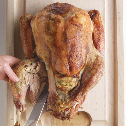 Pull each leg away from the body and slice through skin between breast and drumstick. Bend leg back until thighbone pops out of socket. Cut through joint to detach completely. Pull each leg away from the body and slice through skin between breast and drumstick. Bend leg back until thighbone pops out of socket. Cut through joint to detach completely.