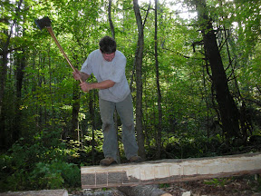 Seth Kelley scores and Ash log from the property to be hewn into a floor joist.