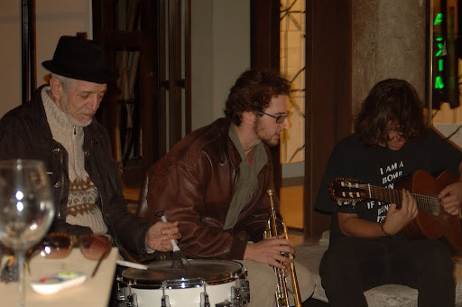 The band- Andrea on guitar.
