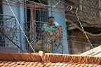 Elderly woman napping on balcony