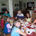 Children in the neighborhood join in the crafts.