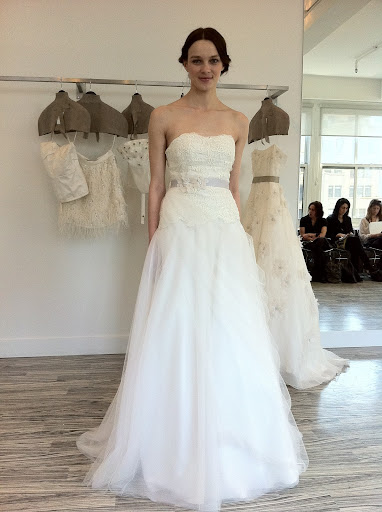 This dress has an embroidered Guipure lace bodice and tulle skirt. You can wear it with or without the belt.