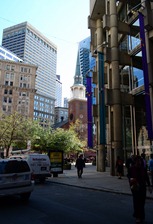 the historic church steeples have all been dwarfed by the skyscrapers