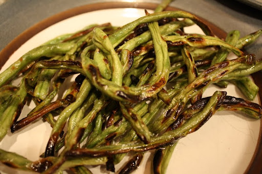 I love grilling my string beans with a touch of olive oil, salt and pepper.