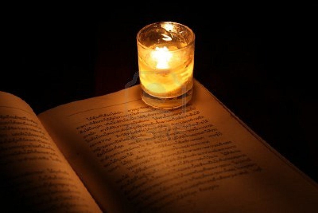 [9645192-reading-under-candlelight%255B3%255D.jpg]