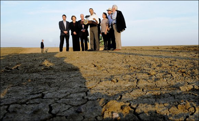 The dry, cracked soil around President Obama speaks to the severity of California's drought, 14 February 2014. President Obama observed, 'We have to be clear. A changing climate means that weather-related disasters like droughts, wildfires, storms, floods are potentially going to be costlier and they're going to be harsher.' Photo: Wally Skalij / Los Angeles Times