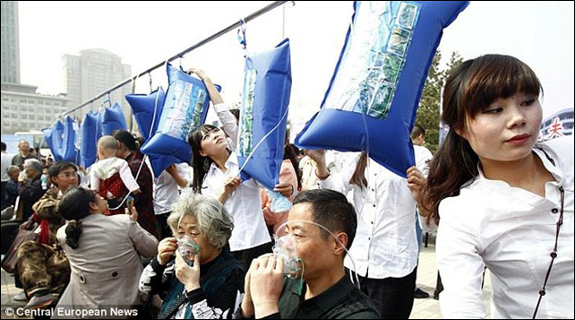 A breath of fresh air: City dwellers in Zhengzhou city, Henan province, are hooked up to oxygen masks so they can breathe in some fresh air as the country's pollution hits crisis levels. Photo: Central European News