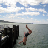 North Island - some dude back flipping in the Auckland bay... it was freezing!