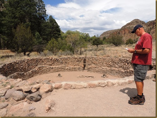 Vic reads the brochure that explains the purpose of the Kiva