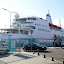 The recently-launched Logos Hope. Note the life-like commemorative statue in foreground.