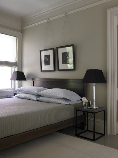 A pair of framed photographs looks chic when hung gallery-style, and works just as well as a larger piece of art. A pair of framed photographs looks chic when hung gallery-style, and works just as well as a larger piece of art.