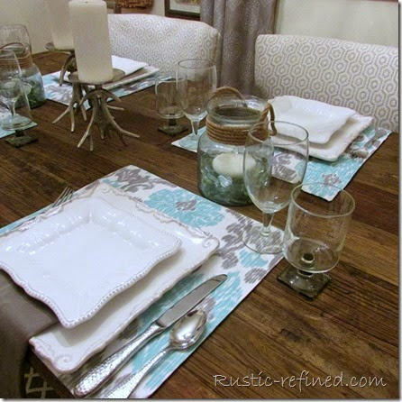 This tablescape was inspired by the temperatures outside. Using cool colors of water and a cold grey sky, I set a modern yet beachy table