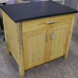 Cedar and knotty pine work Island with antler pulls