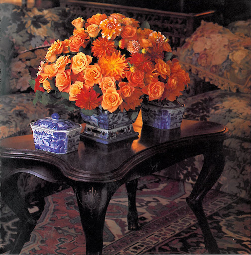 The mixture of dahlias and roses in bright oranges and reds is perfect for fall and winter arrangements. I love the clash between the warm hues of the flowers and the blue and white china. Definitely a showstopper and perfect for an entry hall sideboard. The mixture of dahlias and roses in bright oranges and reds is perfect for fall and winter arrangements. I love the clash between the warm hues of the flowers and the blue and white china. Definitely a showstopper and perfect for an entry hall sideboard.