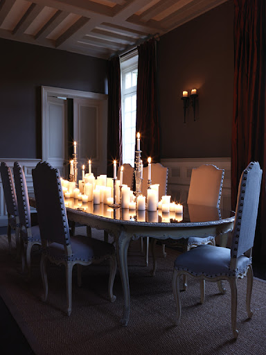 An artfully jumbled collection of candles-pillars, tapers, and votives make a romantic and dramatic center-piece. An artfully jumbled collection of candles-pillars, tapers, and votives make a romantic and dramatic center-piece.