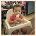 Baby Auni duduk dalam baby chair