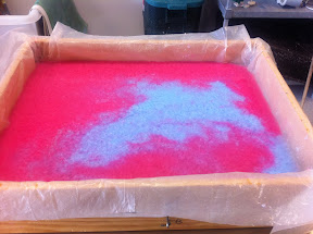 These deckle boxes offer two main advantages:  one, you can make much larger sheets of paper (this box is 22" x 30"), and two, you can swirl together different kinds or colors of pulp for different effects.