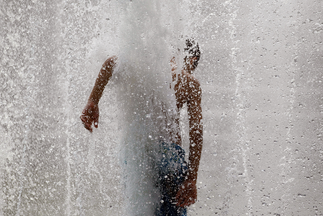 Anthony Martinez plays in the fountain in Manhattan's Washington Square Park on July 21, 2011 in New York City. An extended heat wave has descended on the city with the heat index expected to reach triple digits today. Getty Images