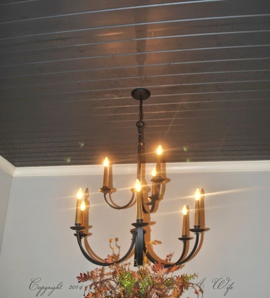 dark grey planked ceiling with hanging traditional chandelier.jpg Dark grey planked ceiling with hanging traditional chandelier