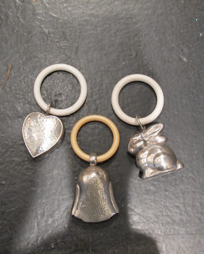 The store also stocks other accessories. Aren't these vintage baby rattles just beautiful?