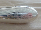 The couple cut the cake using a silver knife from Croghan's Jewel Box, in Charleston. It was engraved with the insignia used throughout their stationery suite.