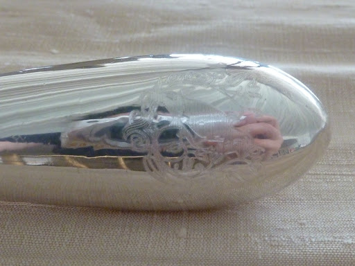 The couple cut the cake using a silver knife from Croghan's Jewel Box, in Charleston. It was engraved with the insignia used throughout their stationery suite.