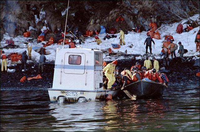 Oil spill cleanup workers are transported by a small boat, named 'Snoopy III', to Naked Island on Prince Williams Sound, during the Exxon Valdez disaster, on 2 April 1989. Photo: Chris Wilkins / AFP