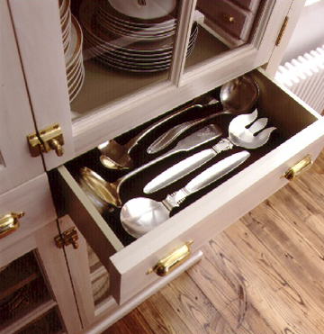 Silverware organizers don't always fit larger items, so Martha likes to lay these flat in a drawer lined with protective material. Silverware organizers don't always fit larger items, so Martha likes to lay these flat in a drawer lined with protective material.