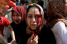 Injured Syrian women arrive at a field hospital after an air strike hit their homes in the town of Azaz on the outskirts of Aleppo, Syria, Wednesday, Aug. 15, 2012. (AP Photo/ Khalil Hamra)