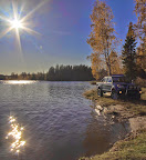 Forfra med mye innsjø og sol i bakgrunnen.jpg