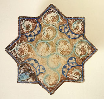 Star Tile | Origin: Iran, probably Takht-i Sulyaman | Period: about 1270-1280 | Collection: Art Museum Council Fund (M.68.22.8) | Type: Ceramic; Architectural element, Fritware, overglaze luster-painted with turquoise and cobalt blue, 1/2 x 7 7/8 in. (1.27 x 20 cm)