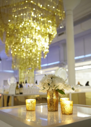 Matthew Robbins used ribbed gold containers for his flowers to go with the metallic theme.