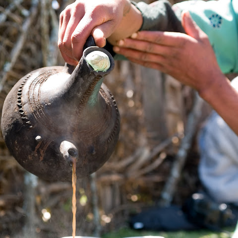 This is part of an elaborate coffee ceremony that takes 45 minutes. It involves: roasting coffee beans; grinding beans, mixing, boiling, decanting and pouring... followed by drinking.