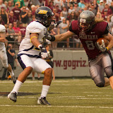 After catching a mid-range pass Montana's Sam Gratton attempts to get past NAU's Lucky Dozier.  Washington-Grizzly Stadium in Missoula, MT, Sept. 22nd, 2012.