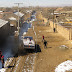 A "Fifth Expedition" truck stalling out in the spring mud of Hengjian Village, near Yu Xian, Hebei.