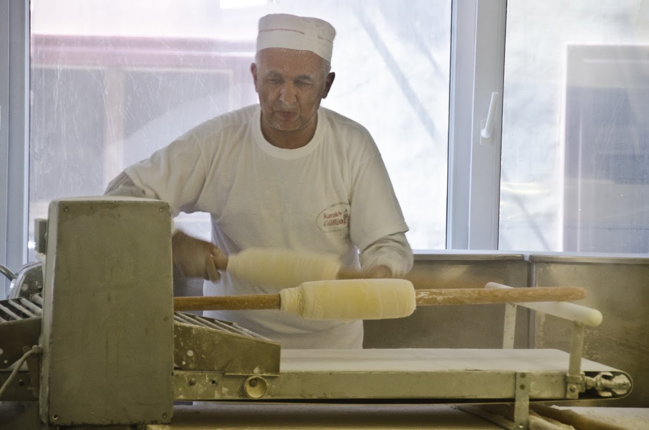 Baklava rolling by machine