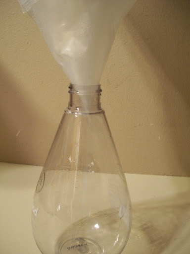 Snip off the bottom corner of a liner and you have a funnel for filling those little containers like salt shakers or soap dispensers without the mess.