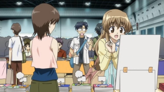 Haruka gushes over a vendor table at a busy anime convention as Yuuta is comically left behind