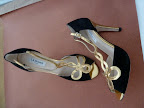 A black-and-gold pair of pumps by L.K. Bennett.