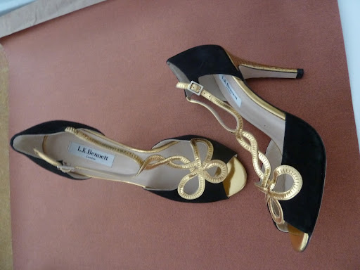 A black-and-gold pair of pumps by L.K. Bennett.