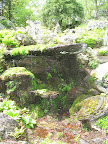 Though this water feature looks natural, it is created by the garden's designer.