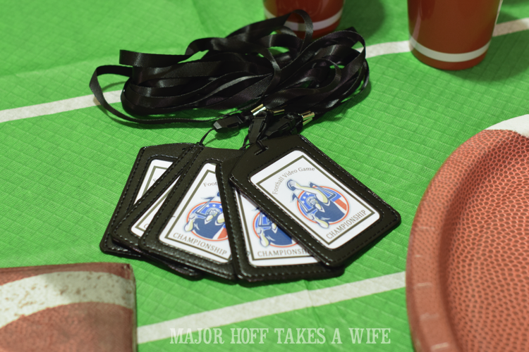Lanyards make for a fun swag idea for a party. Looking for a fun party for your teenage boy? Why not throw a Football video game party? Easy ideas for how to entertain kiddos during the Big Game. Features DiGiorno pizza, personalized football cups, free printable lanyards, and an incredible recipe for football shaped ice cream sandwiches! #GameTimeMVP #CollectiveBias #ad Lanyards make for a fun swag idea for a party. Looking for a fun party for your teenage boy? Why not throw a Football video game party? Easy ideas for how to entertain kiddos during the Big Game. Features DiGiorno pizza, personalized football cups, free printable lanyards, and an incredible recipe for football shaped ice cream sandwiches! #GameTimeMVP #CollectiveBias #ad