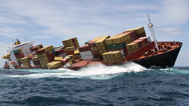 A swell buffets the hull of the cargo ship Rena that was grounded on a reef off Tauranga, New Zealand. AP