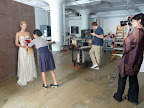 Here's a pulled-back shot, showing photographer Laurie Frankel framing up the shot, and Michael reviewing the photos as they come on to the screen.