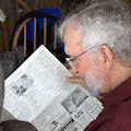 Jim Robert looking at classmates voted best looking:  Bill Craddock and Roni O Donnell