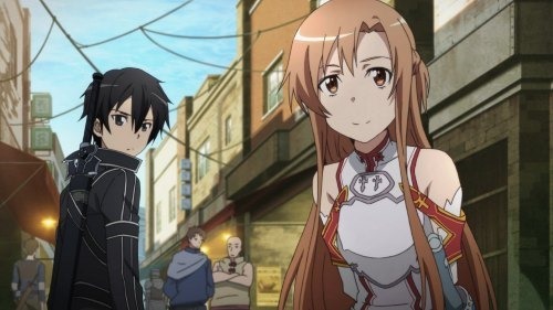 Asuna smiles, arms behind her, as she stands ahead of Kirito, looking grumpy, in the middle of a bustling city street